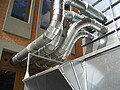 Pipe components form the suction line of the filter system