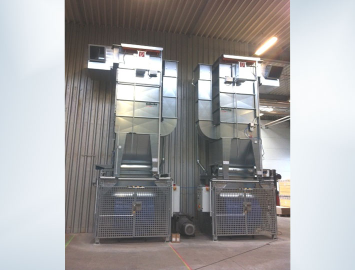 Stationary dust extractor as a double installation with container filling